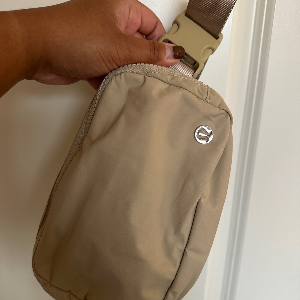 lululemon athletica Tan Crossbody Bag with Silver Logo